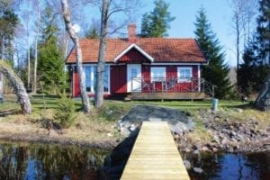 Abgelegenes Ferienhaus in Südschweden am See mit Steg und Boot